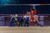 Game official being placed aboard a Survival Flight helicopter at the Calhoun High football field. The time delay between the onset of symptoms to leaving the football field was approximately 52 minutes despite several ambulances on site within minutes.