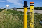 (Jersey County, IL) Spire natural gas pipeline markers at the intersection of IL Rt. 16 and Otterville road Show where the pipeline travels under the highway.