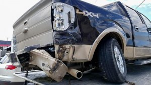 Multiple County Fugitive Chase Leaves A Path of Destruction Another view of truck stolen in Kampsville used by fleeing suspect is on tow truck showing major damage after multiple county chase.