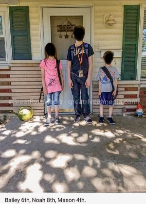 Three Children of Michael & Georgena Roberts on front porch of family home.
