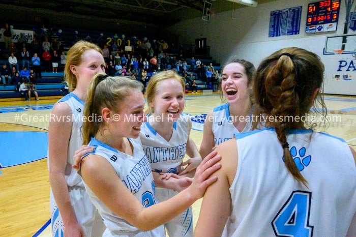 Jersey's Clare Breden being congratulated by teammates after getting 1000th high school career points.