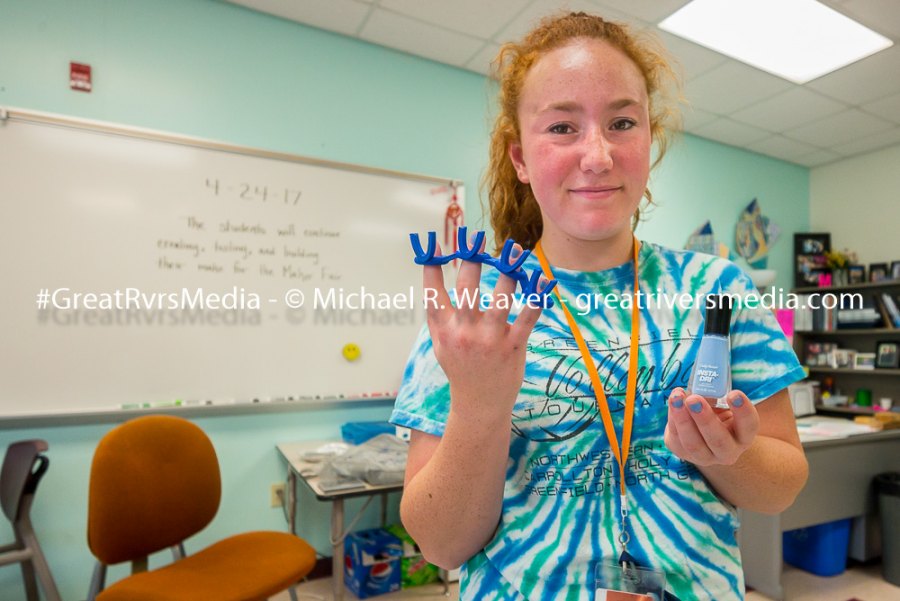 Emma Plasmeier shows her fingernail polishing guide that will be on display at the Maker's Fair.