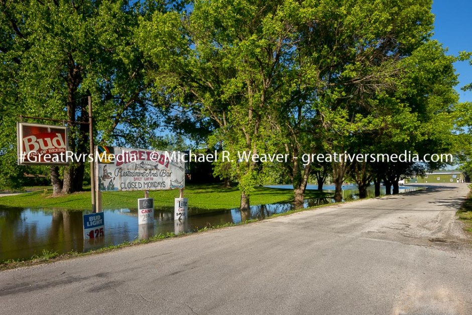 Flooding Continues to Hamper Traffic and Commerce The entrance to Barefoot in Hardin shows an emply parking lot but no water Tuesday evening.