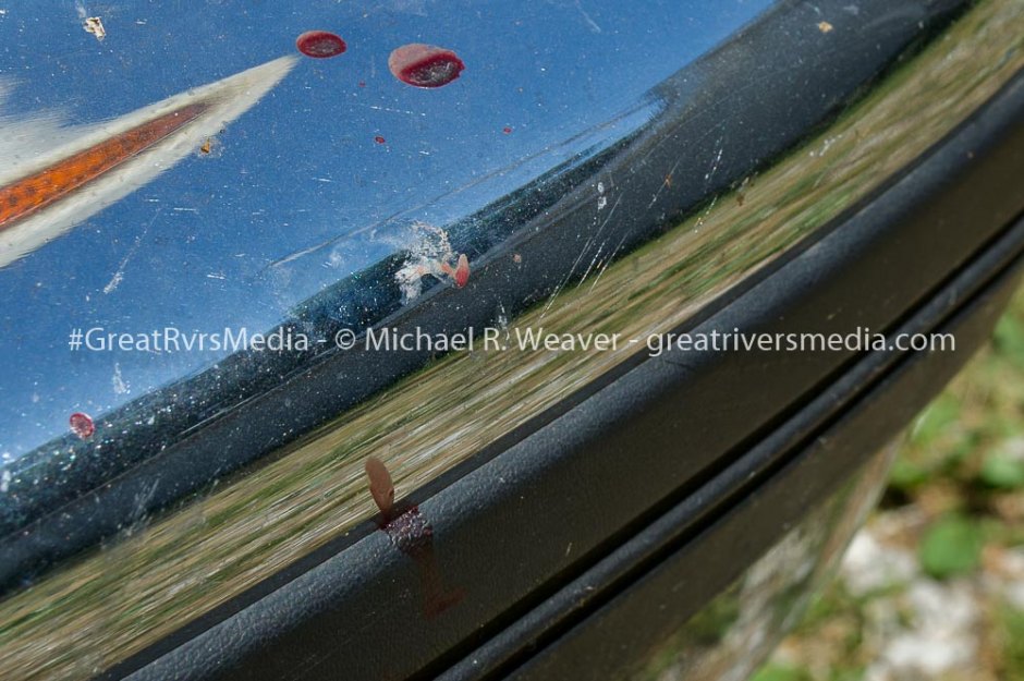 Blood spatters on vehicle bumper from shooting that left suspect dead and office wounded early Tuesday morning. The vehicle was parked next to home that had bullet entry hole. Bullet was not recovered.