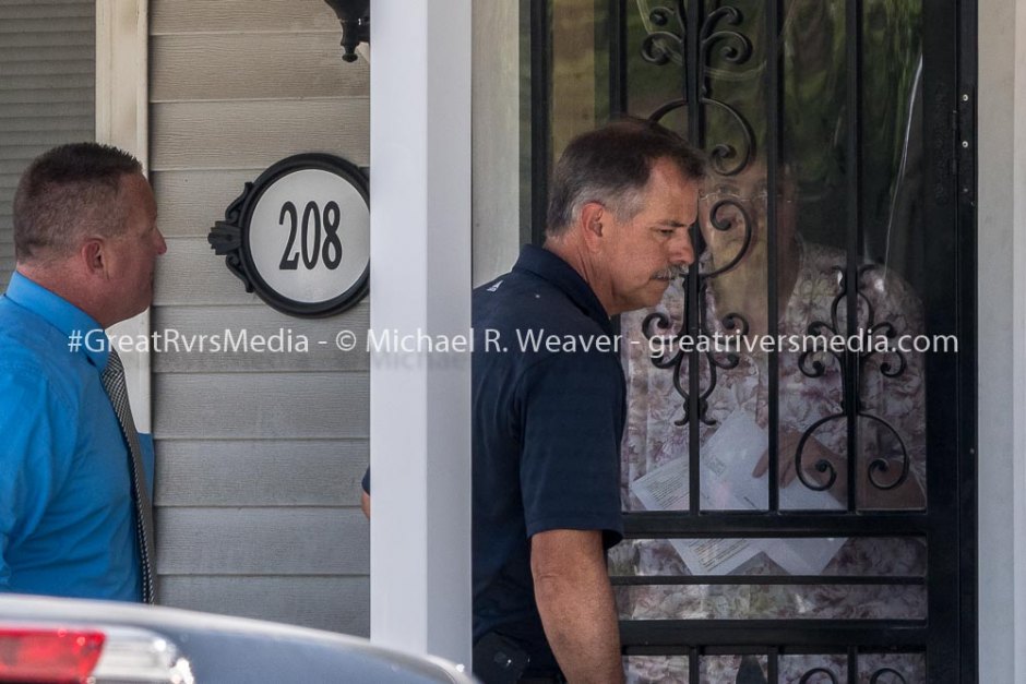Police Shooting in Jerseyville Resident in home next to shooting listens through her door as Jerseyville officials explain what they will be doing at crime scene.