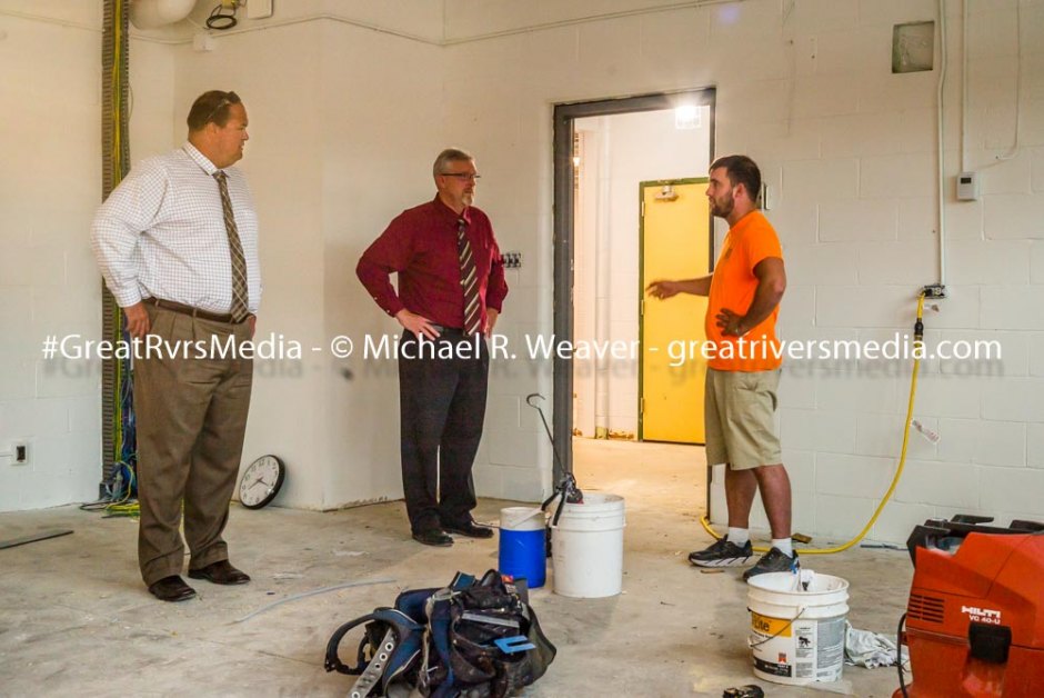 North Greene Superintendent of Schools Mark Scott (left) and a school board member discuss renovations at the Roodhouse elementary level attendance center.