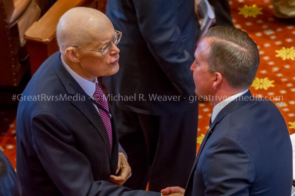 Senator Bill Haine on left congratulates Senator Andy Manar on passage of school funding bill.