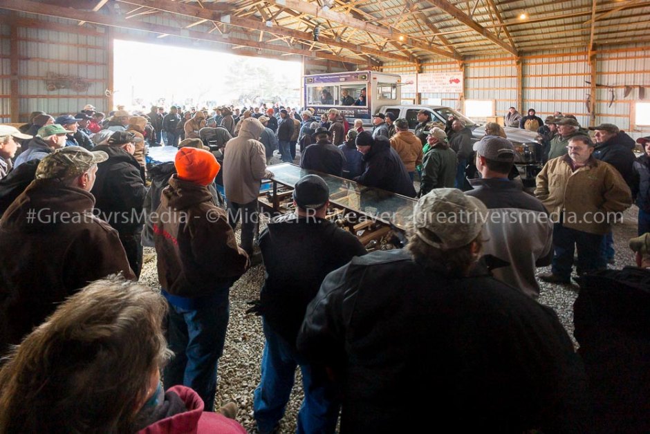 Auction attendees prepare for bidding